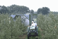 Man On Sprayer In Orchard - Photo Courtesy of NY Apple Association